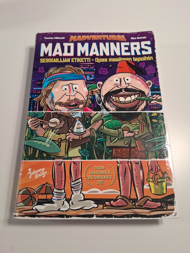 Kirja tekijöiden nimikirjoituksilla