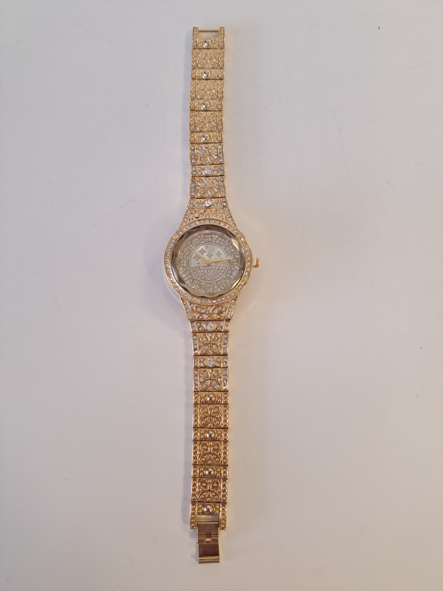 Käyttämätön kullanvärinen naisten rannekello