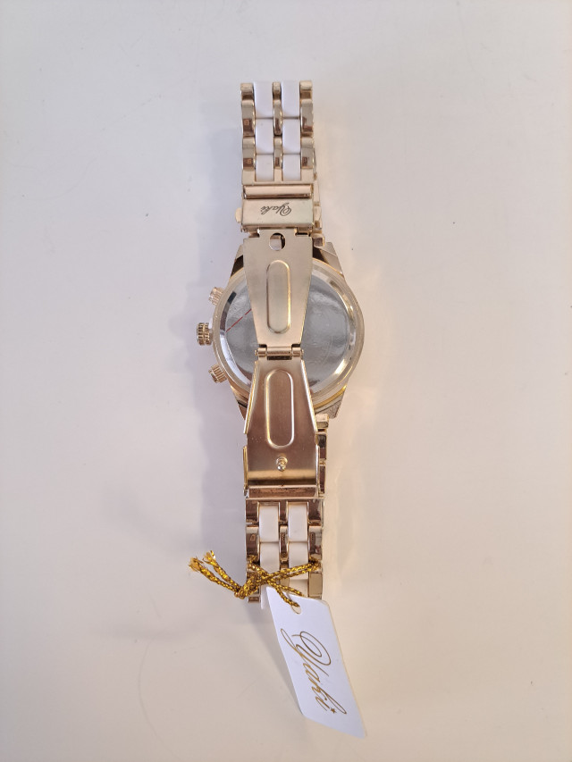 Käyttämätön kullanvärinen naisten rannekello