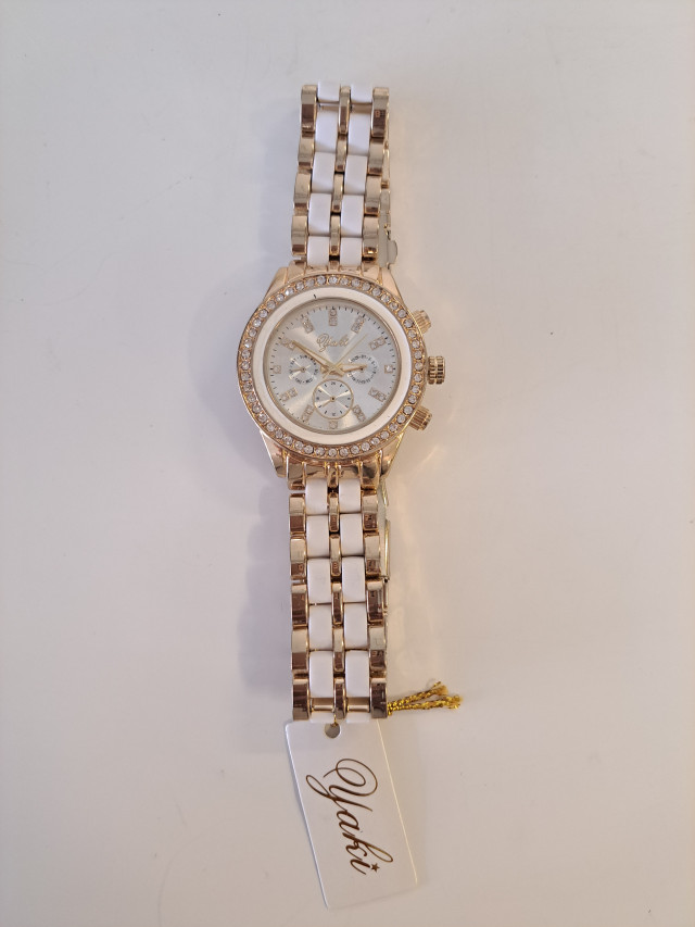 Käyttämätön kullanvärinen naisten rannekello