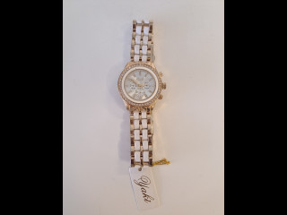 Käyttämätön kullanvärinen naisten rannekello